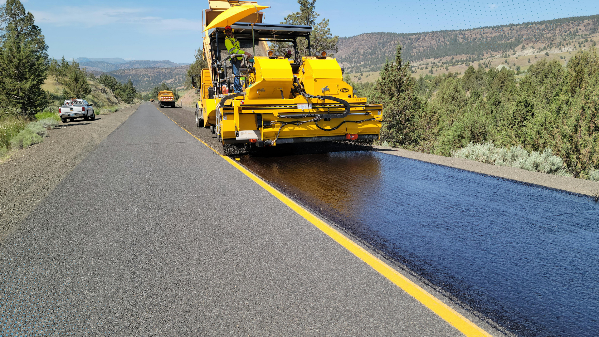 Road construction machinery laying a new road