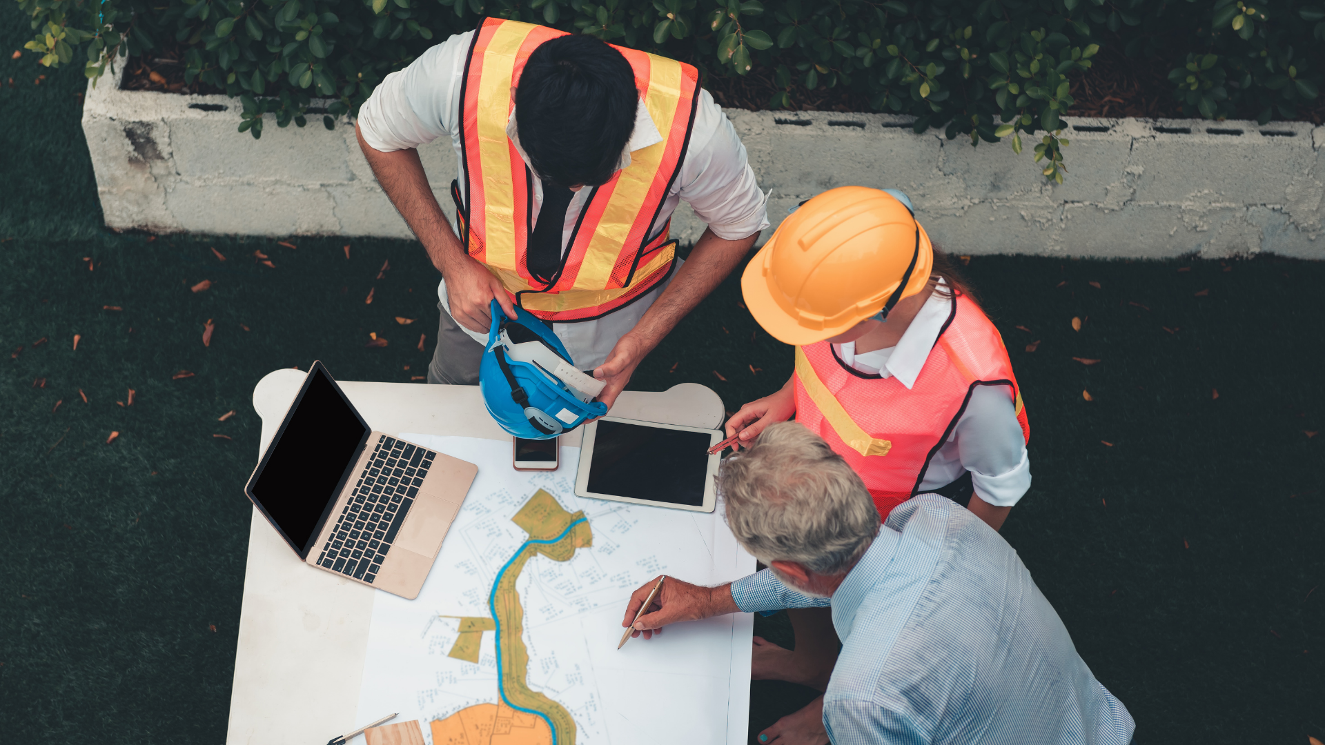 Construction professionals reviewing plans