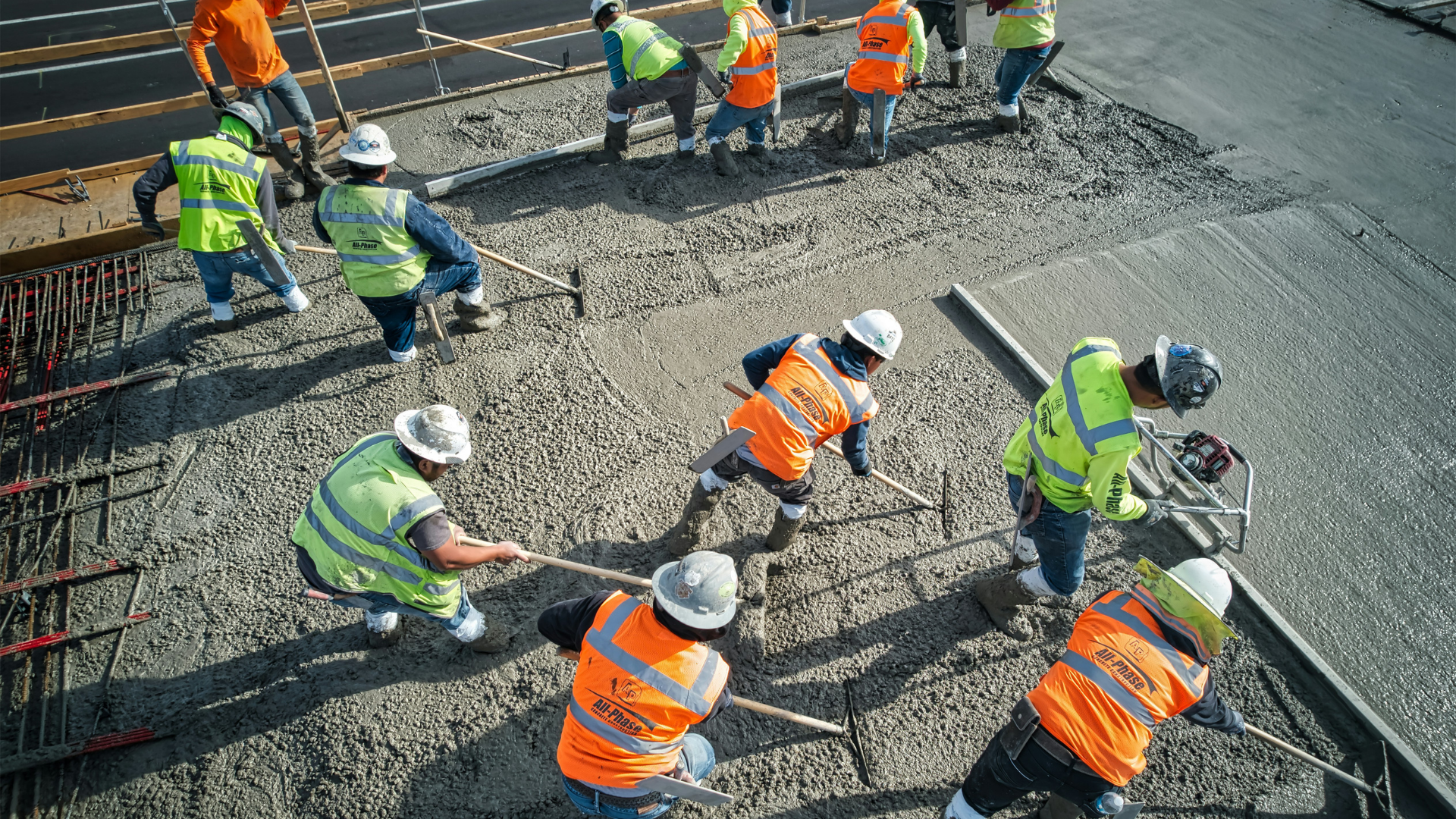 Team placing and levelling concrete
