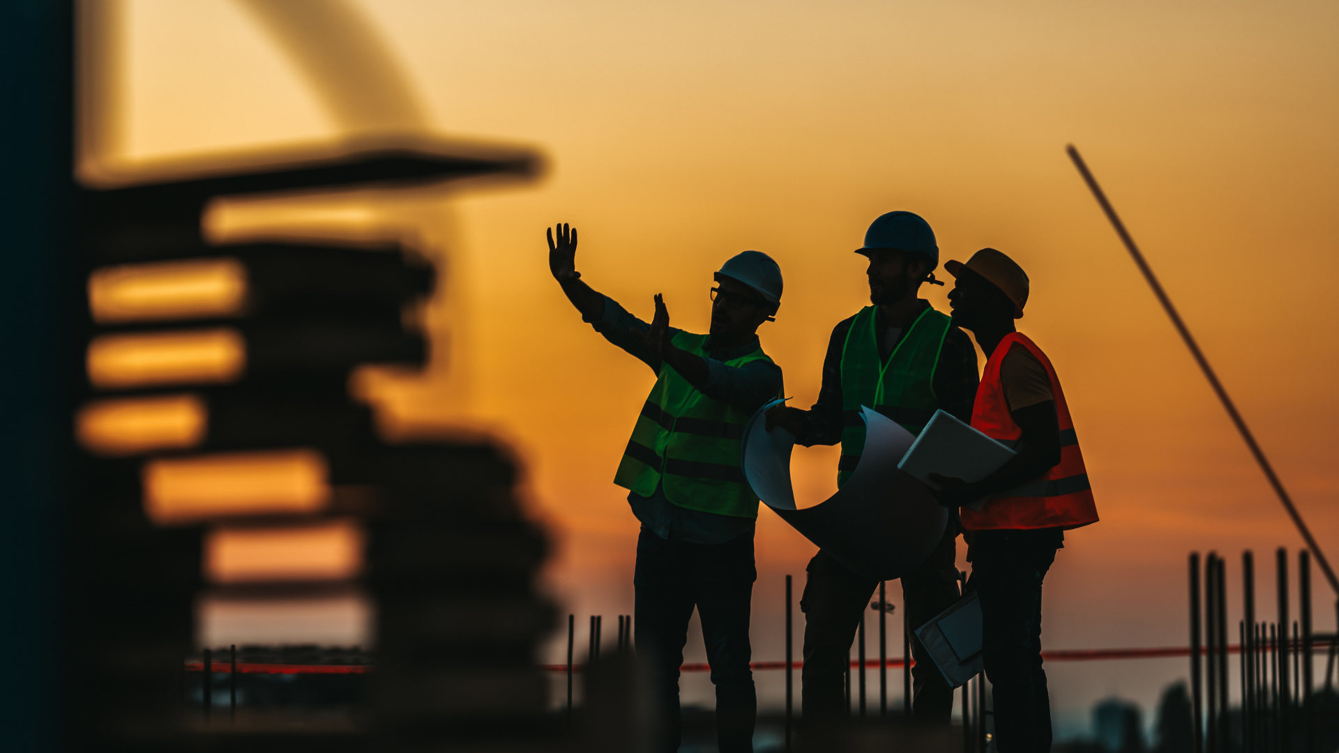 Construction team planning work on site